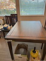 Top view of rectangular wooden dining table with brown finish