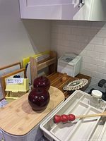 overview of lot showing cutlery trays, cutting boards, wooden apple containers and other accessories