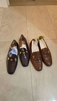 Both pairs of loafers side by side for overall view