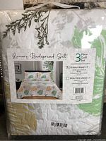 Front of packaged quilt set showing label and pattern