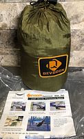 Drawstring stuff sack with DEVODON logo and instruction sheet