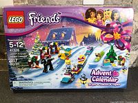 Front of sealed LEGO Friends Advent Calendar box showing set number 41326, 217 pcs, ages 5-12