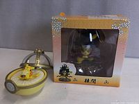 Boxed ninja Pikachu next to domed sleeping Pikachu display