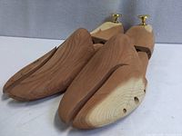 Pair of cedar shoe stretchers angled view