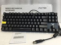 Keyboard front view with box showing branding and full key layout