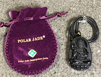 Pendant necklace and branded pouch full view
