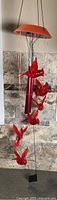 Full view of hanging cardinal cascading wind chime