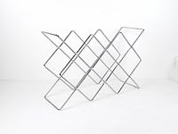 Angled side view of chrome wire wine rack