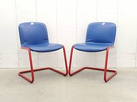 Front angled view of both cantilever chairs