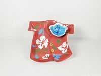 Top view of ceramic Hawaiian shirt-shaped tray with attached dip bowl