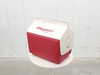 Front view of red and white Igloo Playmate cooler showing logo and handle