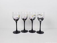 Front view of four Luminarc wine glasses