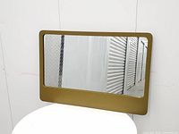 Front view of rectangular mirror showing frame and glass