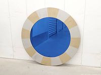 Front view showing full blue mirror and alternating gold/silver frame