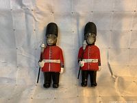 Front view of both donkey guard figurines