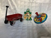 Group shot: spinning top, Radio Flyer wagon, sealed candle