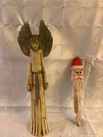 Front view of resin angel and wooden Santa