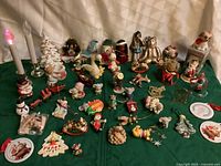 Overall view of all ornaments spread on green cloth