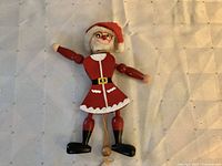Front view of wooden Santa jumping jack puppet