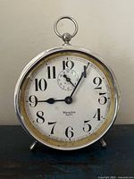 Front view of Westclox Big Ben Peg Leg alarm clock showing dial and feet