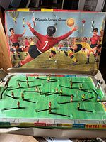 Game in box showing complete playfield and players