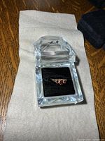 Ring in clear faceted display box