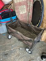 Overall view of brown fabric collapsible wagon