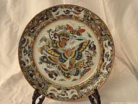Front view of plate showing full butterfly decoration