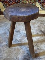 Full view of octagonal oak stool with three legs