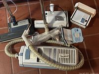 Overall view of Electrolux canister, hose, power nozzles, filter bags