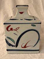 Front view showing square shape, abstract enamel decoration