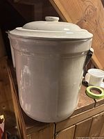 Front view showing crock body and lid