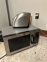 Microwave front and toaster on top