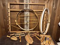 Overall lot showing rack, hoops, shuttles, carders and small tools
