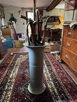 Full view of stand with umbrellas inside