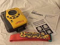 Front view of Sony WM-FS493 Walkman, manuals, strap