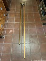 Full length view of the three croziers on tiled floor