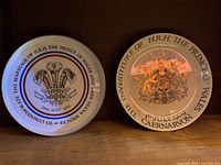 Both commemorative plates side by side