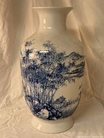 Front view showing detailed bamboo, house and mountain scene