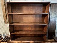 Front view of oak bookcase showing shelves and overall structure
