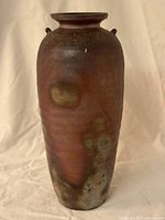 Front view of cylindrical Bizen-ware vase showing multitone surface