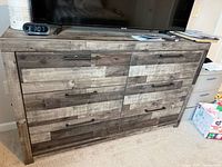 Front view of eight-drawer dresser showing finish and hardware