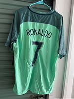 Back view showing Ronaldo 7 lettering and mint green colour