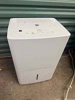 Front and top view of GE dehumidifier showing overall condition