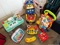 Group shot of all seven toys arranged on floor