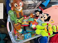 Overview of entire tote with all plushes and toys visible
