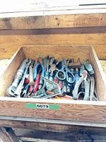 Drawer filled with assorted hand tools