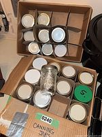 Boxes of canning jars with lids and rings