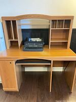 Front view of oak-look computer desk with hutch and keyboard tray