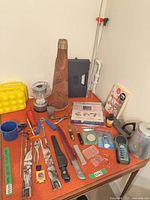 Overview of all camping and hunting items on tabletop